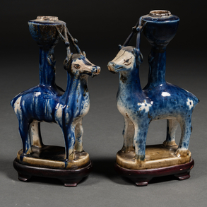 Pair of animal-shaped candlesticks in blue glazed ceramic. Chinese work, End of XIX- XX Century.