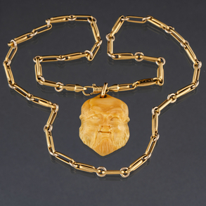 Cadena de eslabones en oro amarillo de 18 kt con colgante en forma de cabeza de anciano chino en marfil.