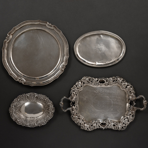 Set of four trays in silver and punched twentieth century.