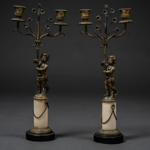 Pair of two-light candlesticks in gilded bronze and circular plinth in white marble with circular base in black marble of the nineteenth century