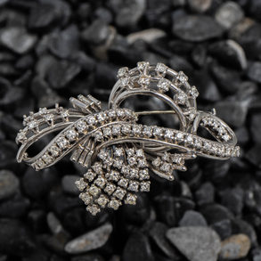 18kt white gold bow brooch with diamonds.