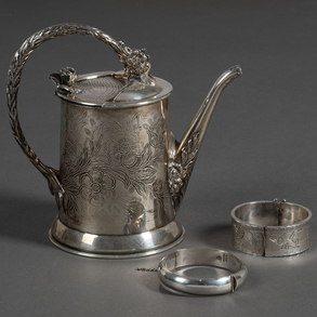 Set of a watering can and two bracelets in 20th century silver, punched.