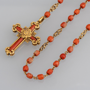 Rosary in faceted red coral beads and cross bordered in 18kt yellow gold