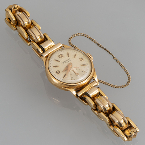 Radiant 17 rubies, lady's watch with 18kt yellow gold case and gold plated bracelet