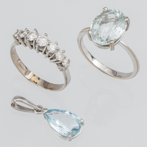 Set of 18kt white gold ring with diamonds and 18kt white gold ring and pendant with topaz.