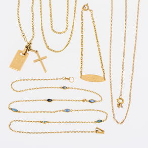 Set of choker with blue crystals, bracelet, chain with cross pendant and chain with loose clasp in 18kt yellow gold.