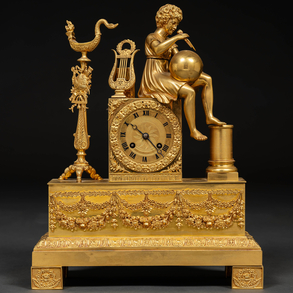 French table clock Louis XVI style in gilded bronze. French work of the XIX century.