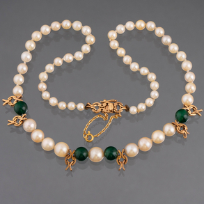Cultured pearl necklace with four green jade beads and 18kt yellow gold clasp.