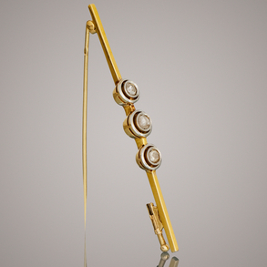 Pin in 18kt yellow gold and 18kt white gold with three old cut diamonds.