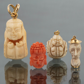Set of three pendants in bone and coral with 18kt yellow gold setting.