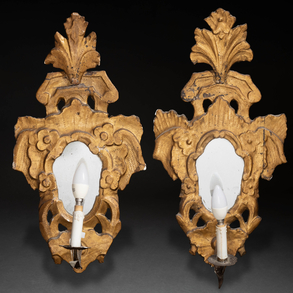 Pair of cornucopias in carved and gilded wood with wrought iron candlestick late eighteenth century.