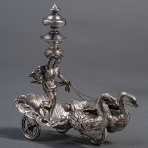 Purera in the form of a chariot with swans and classic lady on a 19th century silver venery.