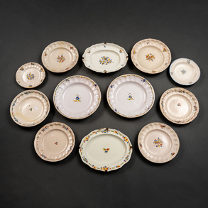 Set of twelve Alcora ceramic plates and trays from the 18th century.