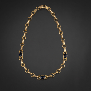 18kt yellow gold link bracelet with three blue crystals.