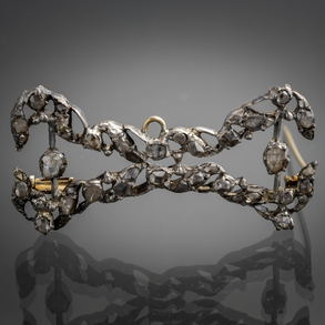 Pin or pendant made of silver with old brilliant-cut diamonds.