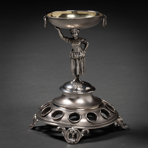 Purera in embossed silver with woman as tenant of the nineteenth century.
