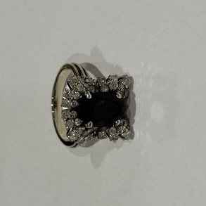 Ring in 18 Kt white gold with diamonds and synthetic sapphire.