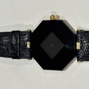H Stern octagonal octagonal watch in 18kt yellow gold with diamonds and blue crystal dial.
