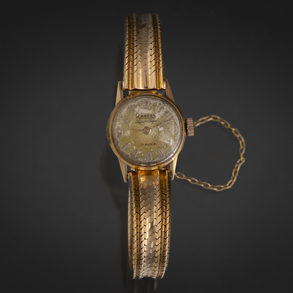 Kandex, 17 rubíes, Reloj de dama en oro amarillo de 18 kt.