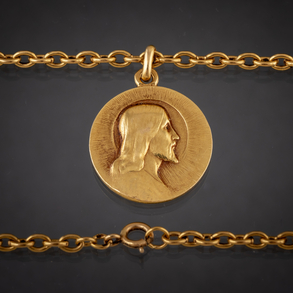 Cadena y medalla circular de la virgen en oro amarillo de 18 kt.