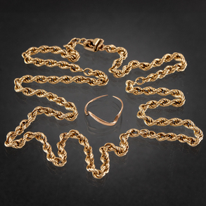 Conjunto de cadena en formade cordón y montura en de anillo (roto) en oro de 14 kt