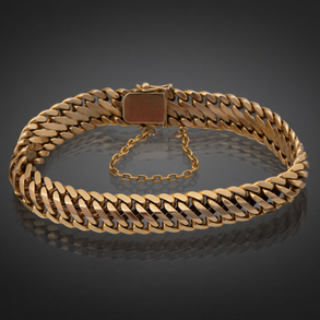 Bonita pulsera en oro amarillo de 18kt con cadena de seguridad.